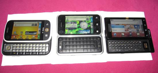The Motorola Backflip Android phone, next to a Cliq and Droid